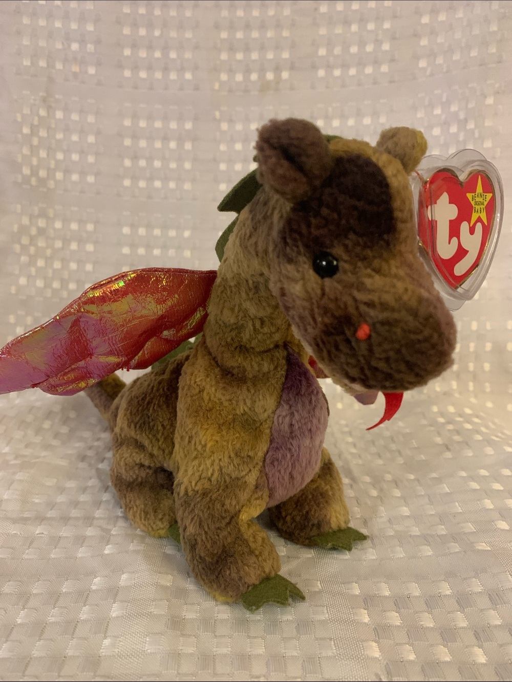 TY Beanie Baby “Scorch” brown plush dragon with pink-gold iridescent wings